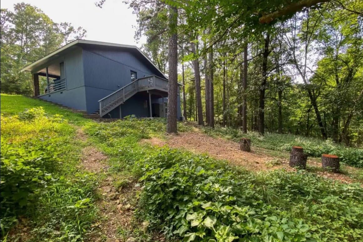 Backyard firepit and deck with forest view